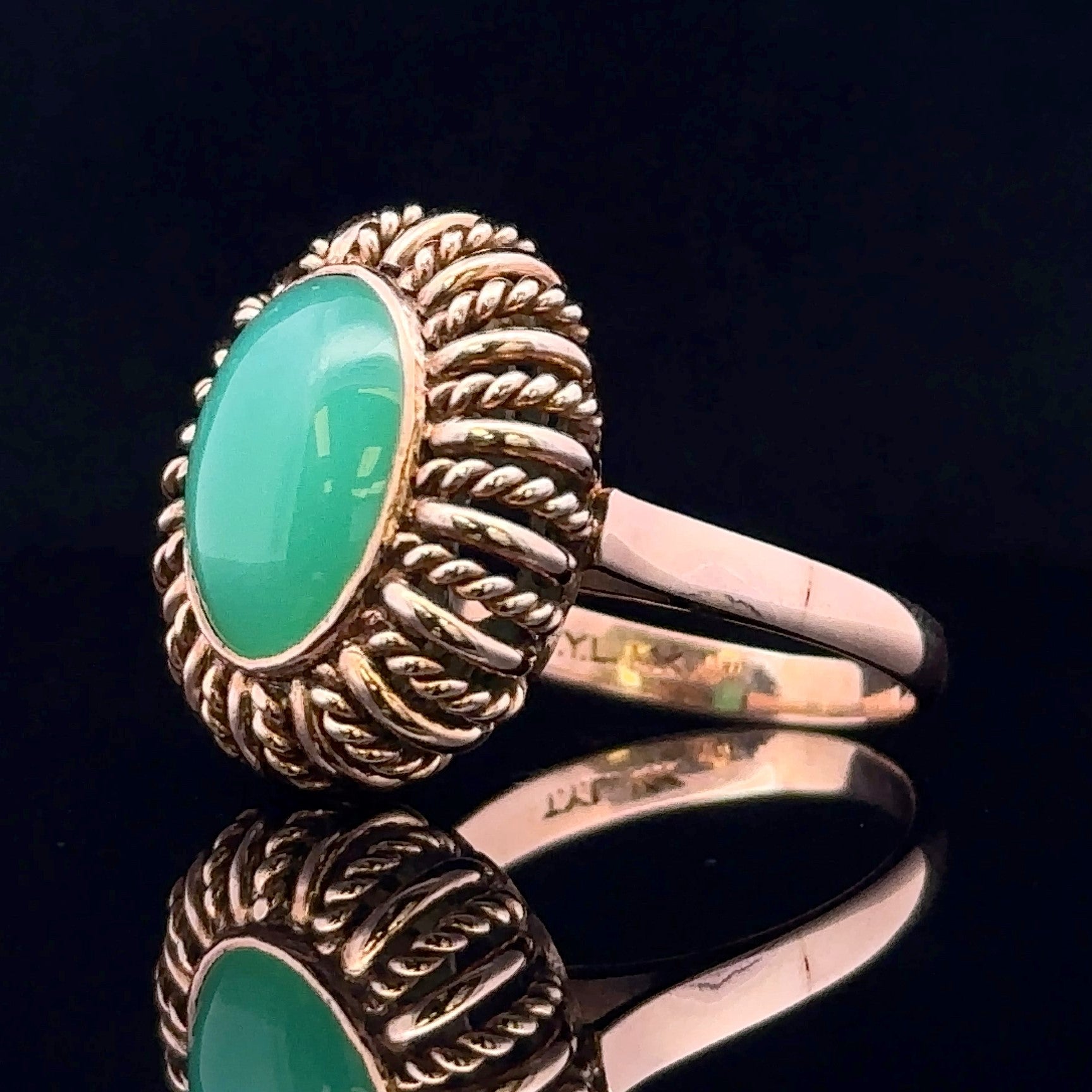 Side view of 14 karat textured gold ring
