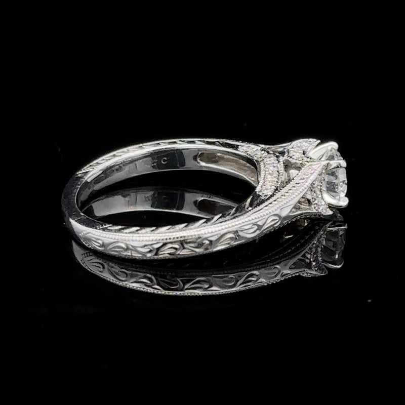 Detailed filigree engagement ring with multiple diamonds by Veleska Jewelry