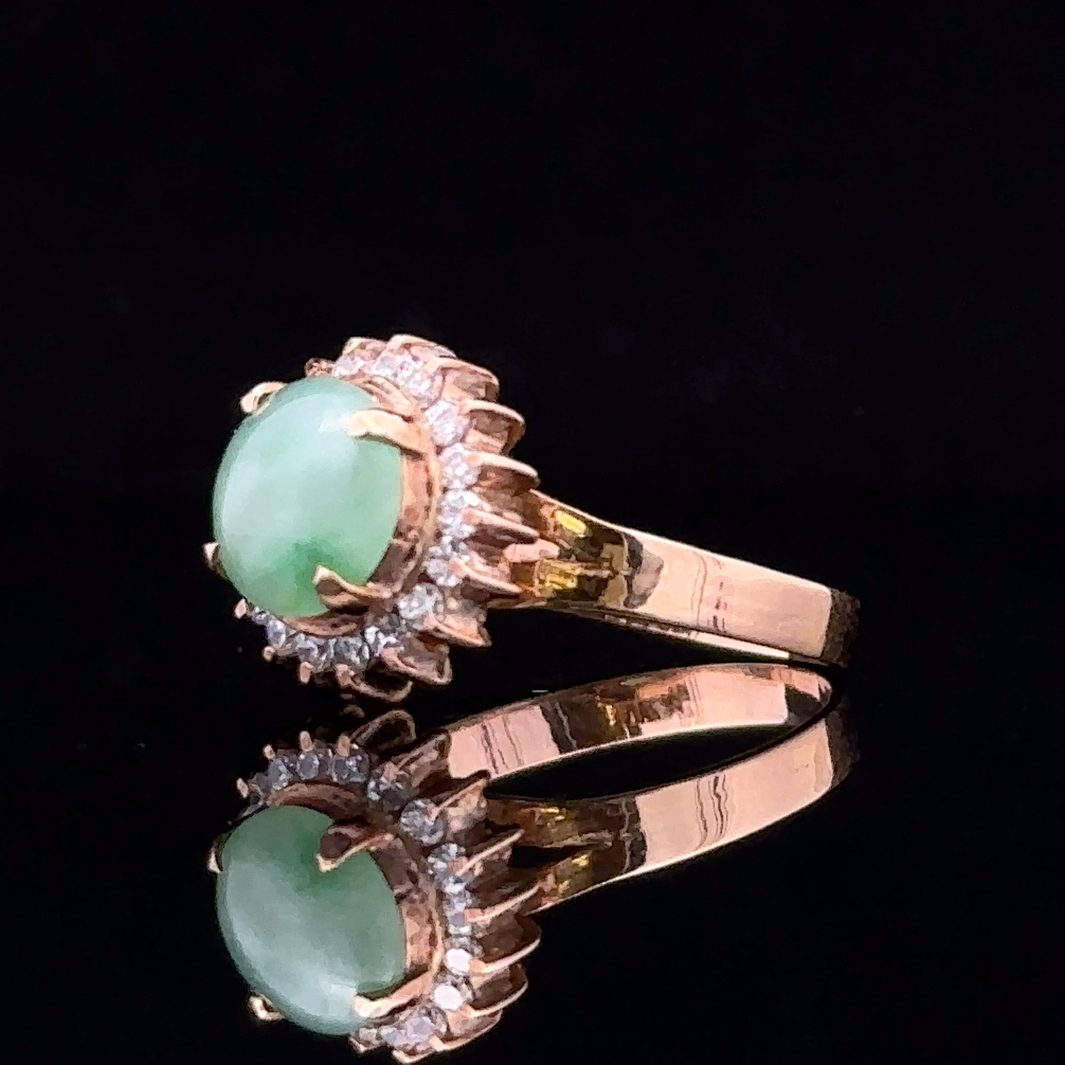 Side view of 18 karat Corinne ring with jade and diamond details
