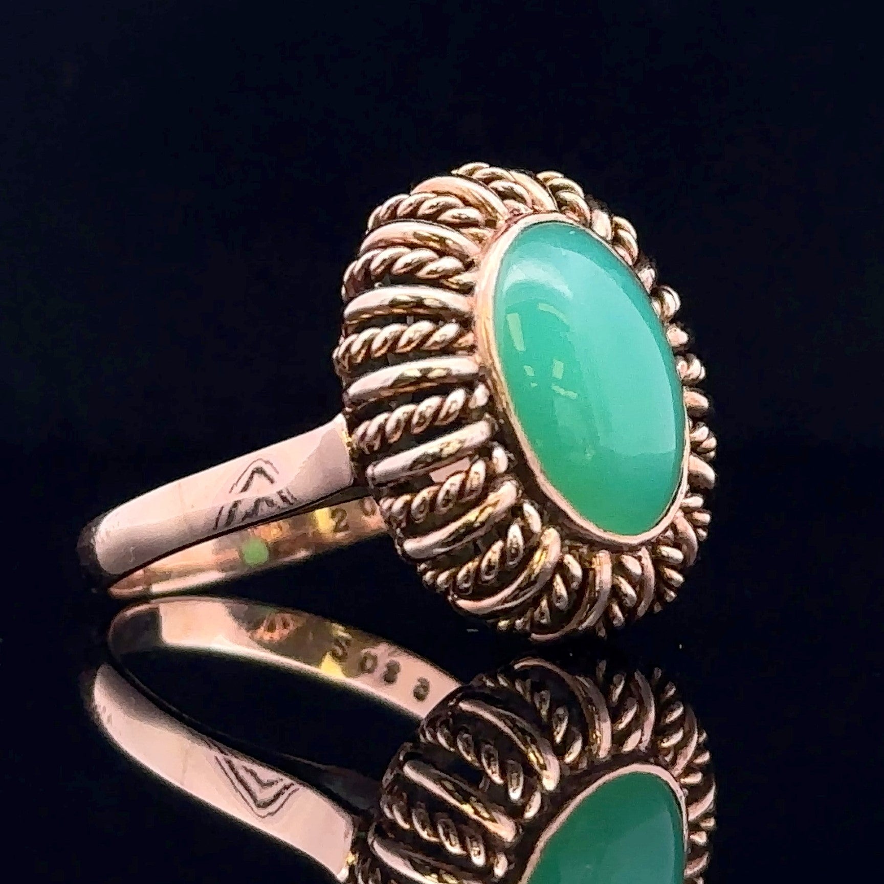 Close-up of textured gold Summer ring with jade