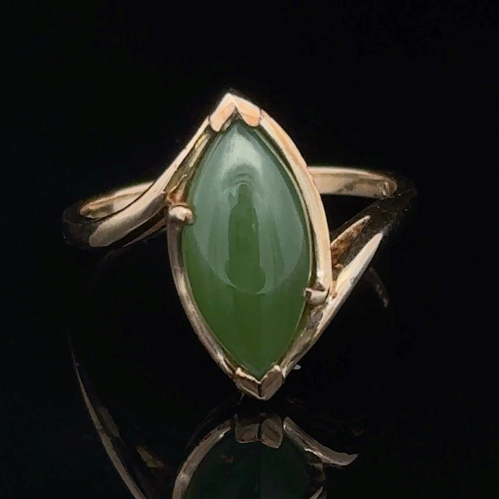 Marquise jade stone in polished yellow gold setting