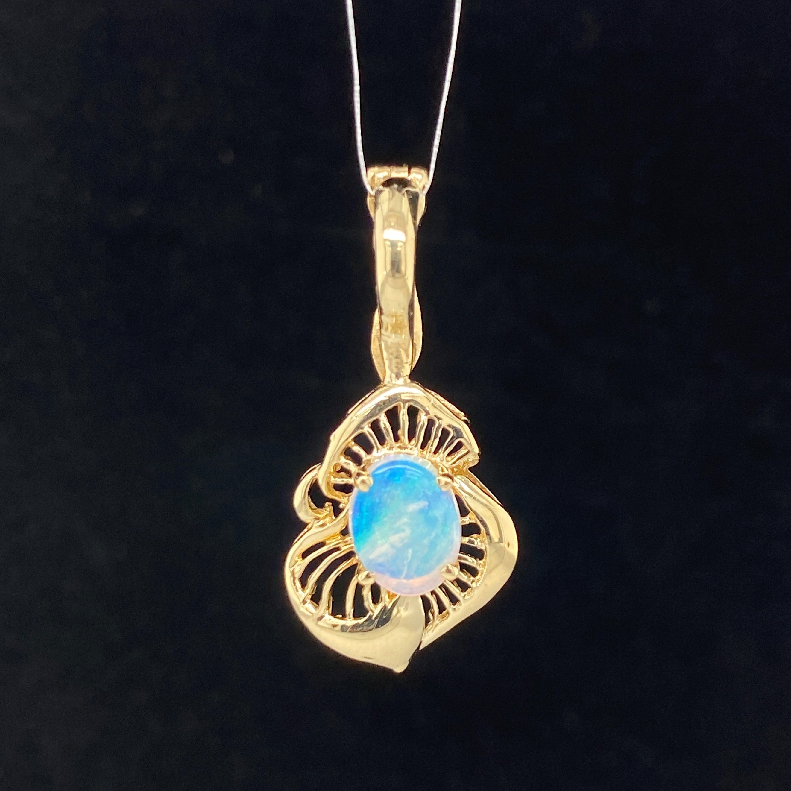 Yellow gold free form pendant with blue opal