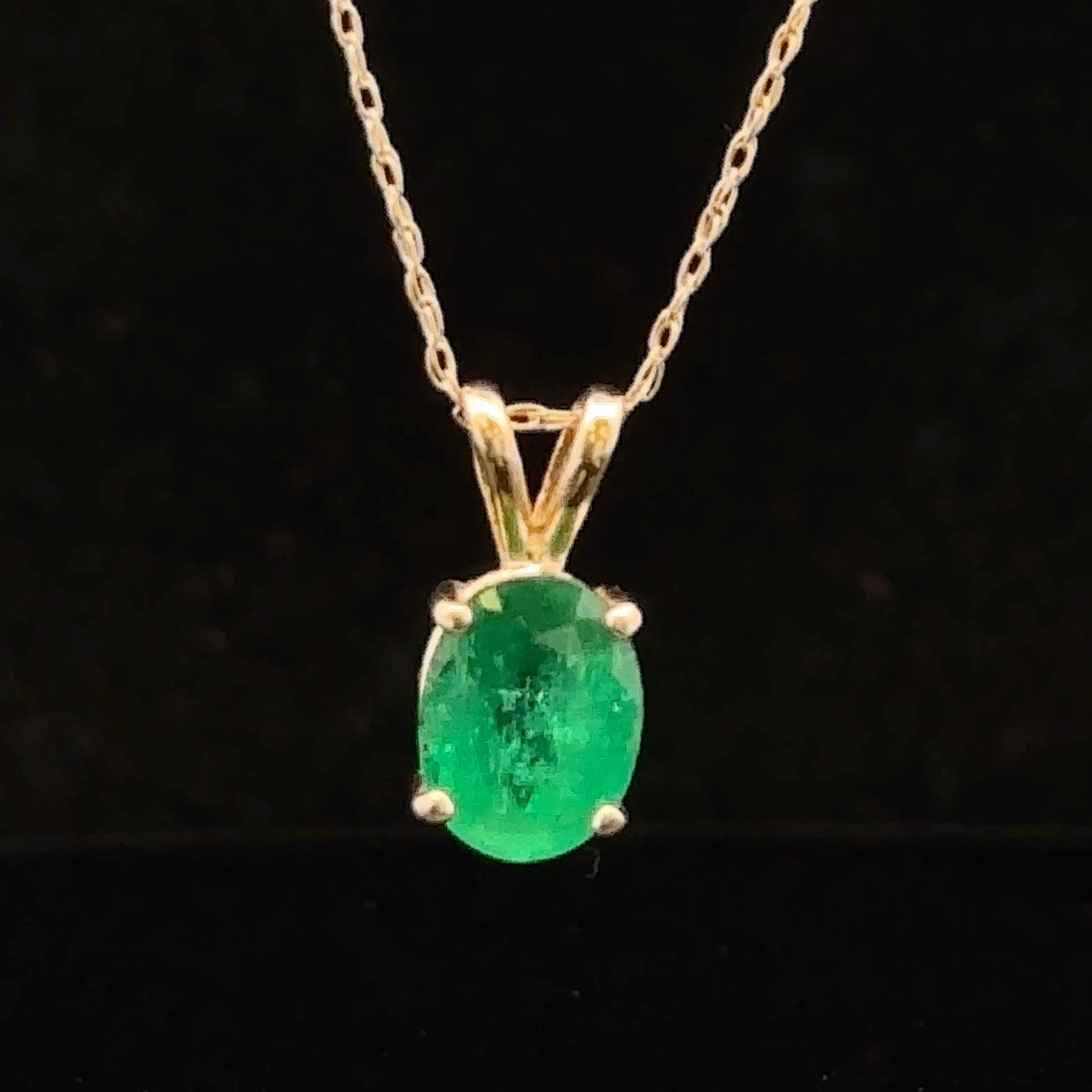 Yellow gold solitaire necklace with green emerald