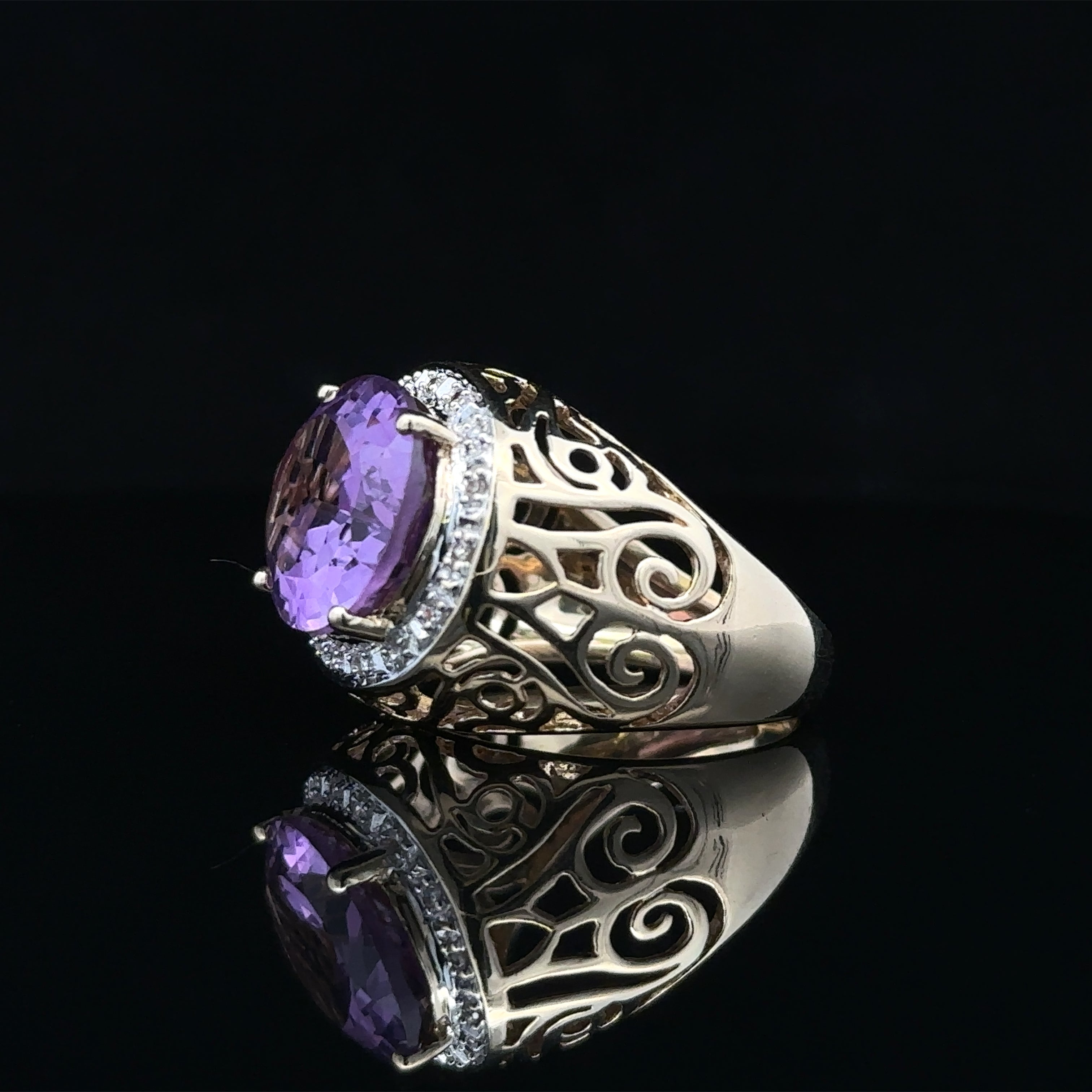 Oval amethyst ring with 16 single cut diamonds