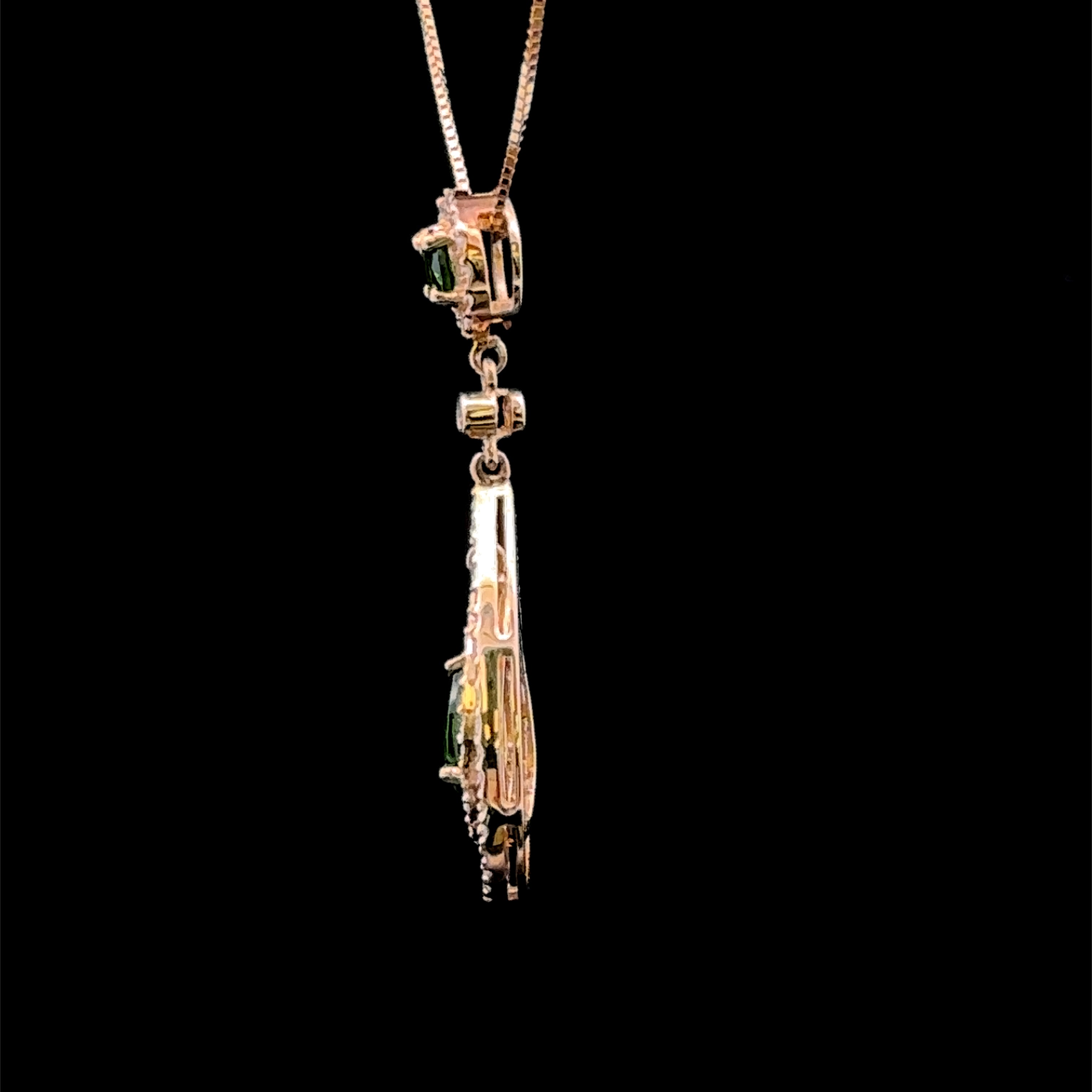 14K yellow gold pendant with green gemstones