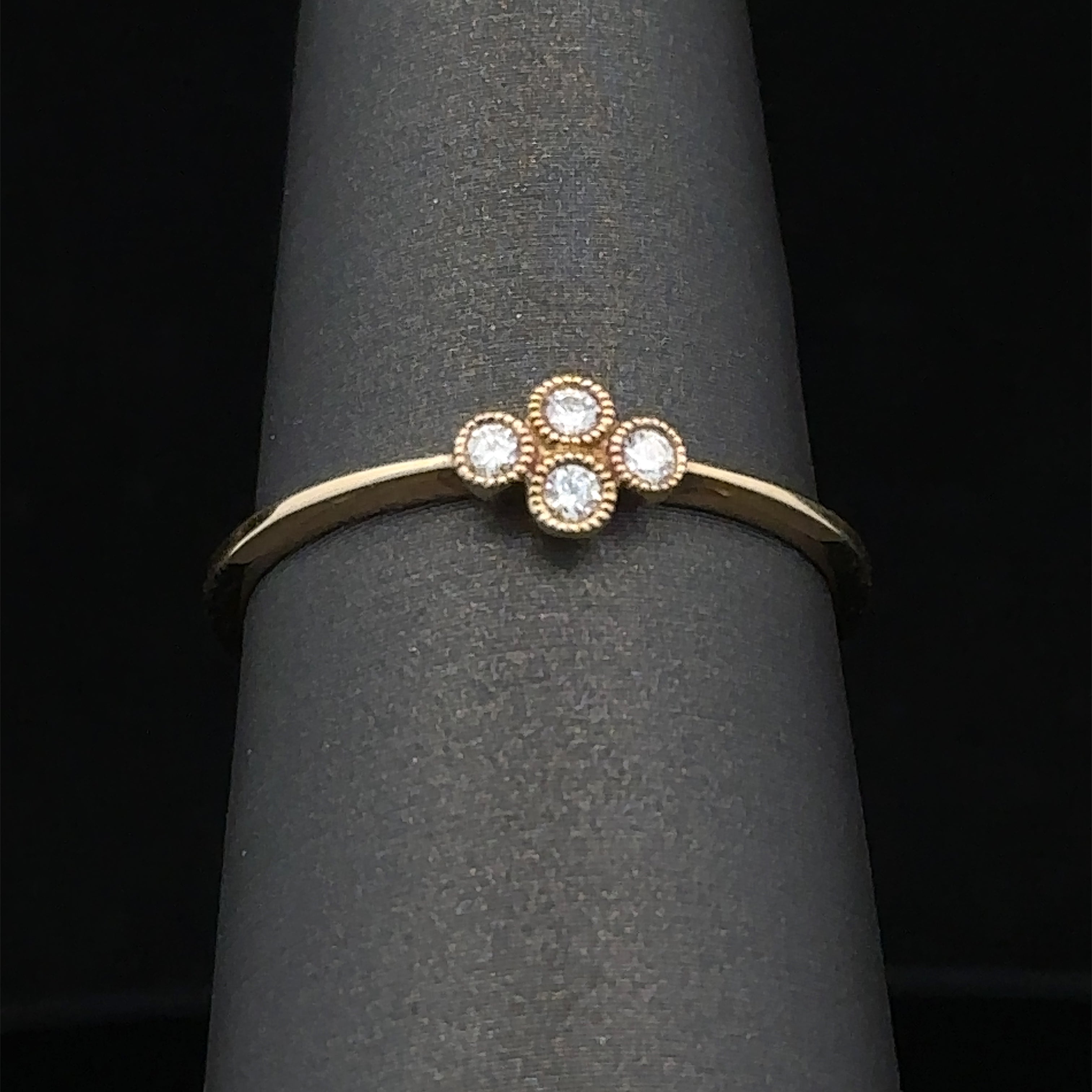 Yellow gold diamond ring with four stones