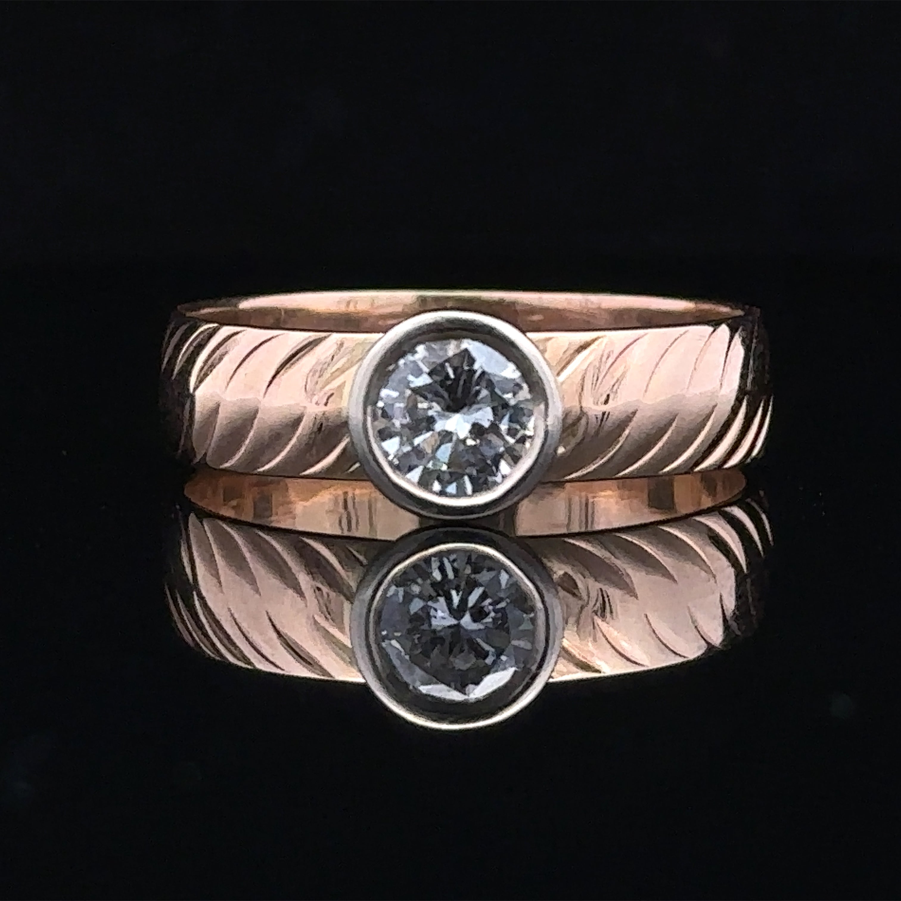 Elias two-tone 14K gold ring with bezel-set diamond