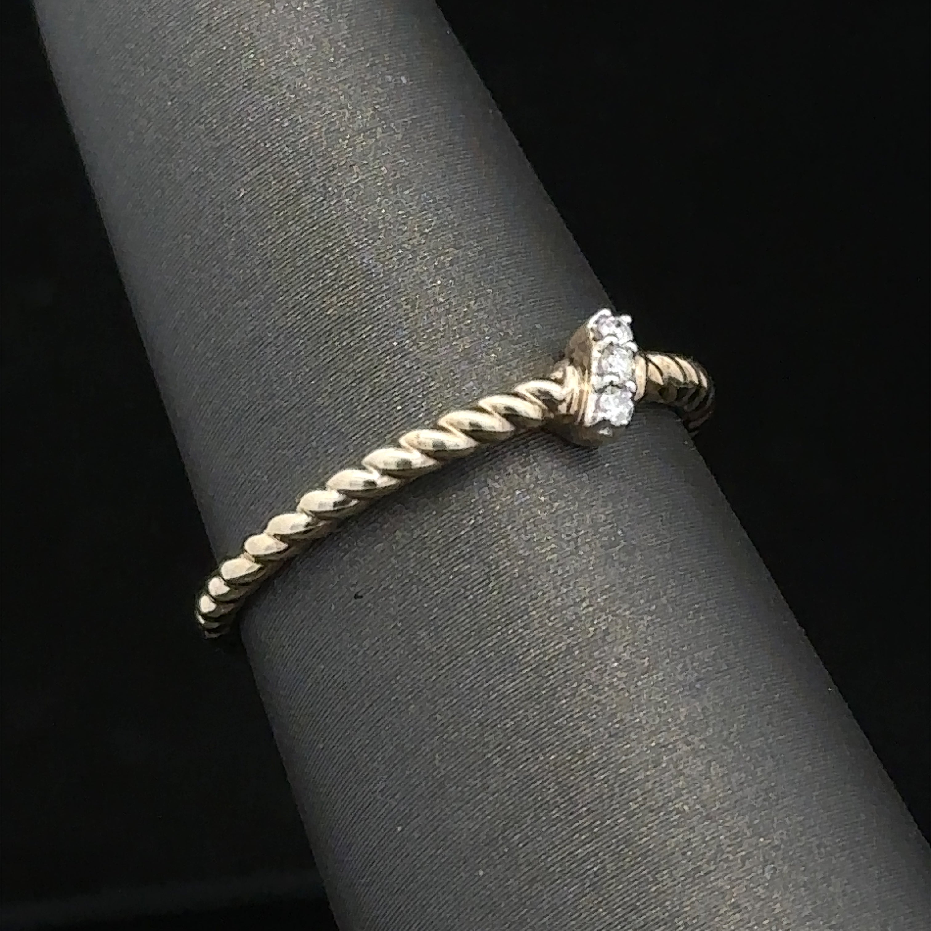 
10K gold twist fashion ring with three stones
