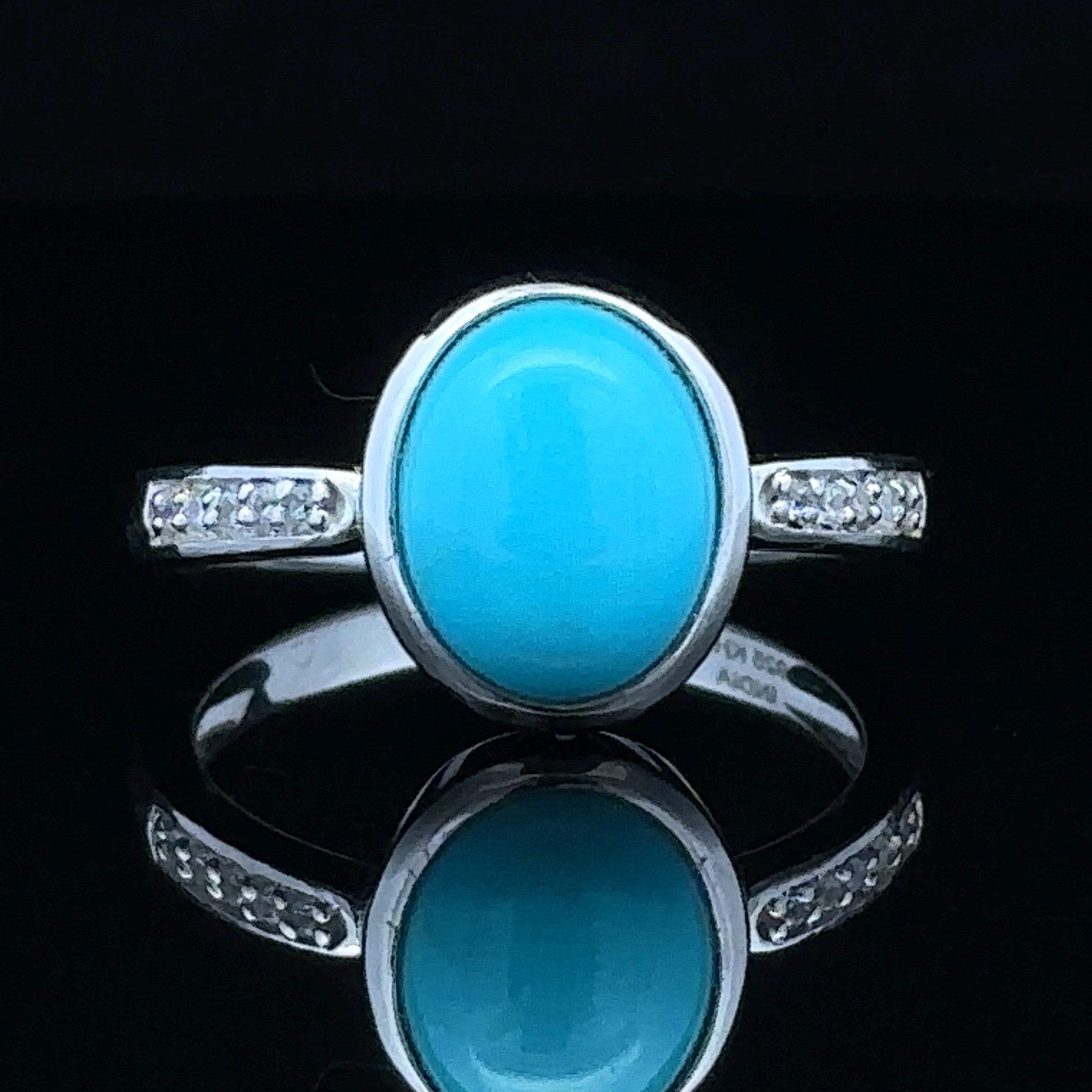 White silver ring with stabilized turquoise
