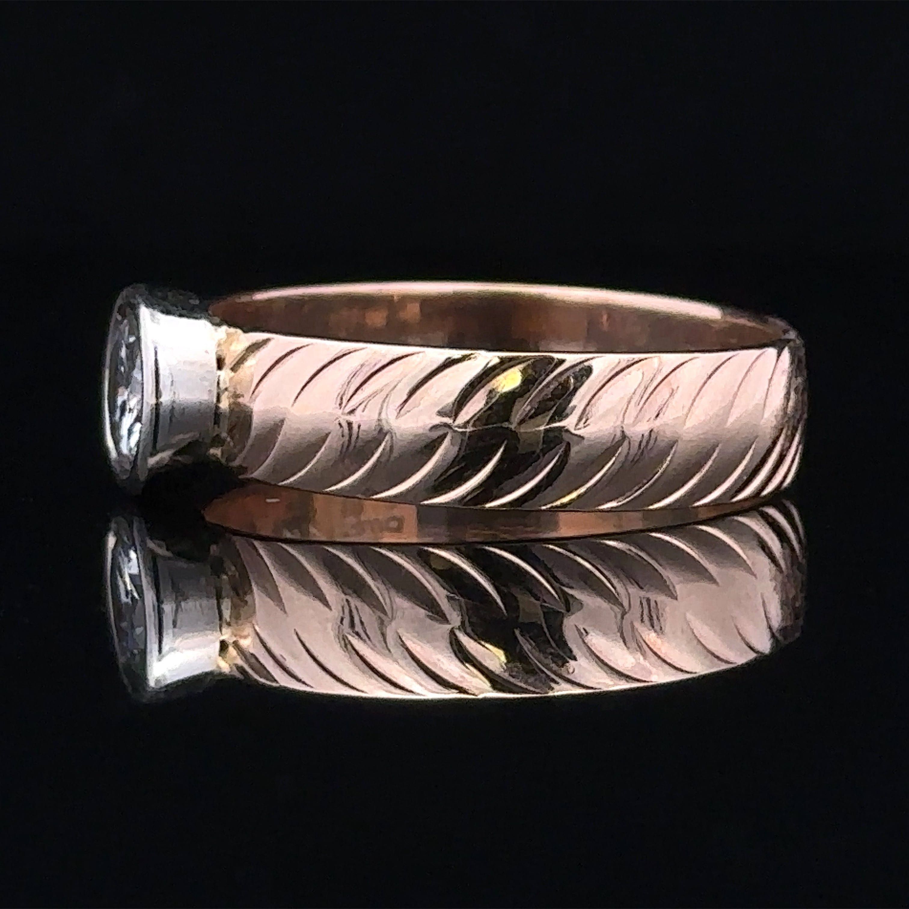 Side view of Elias two-tone gold ring with round diamond