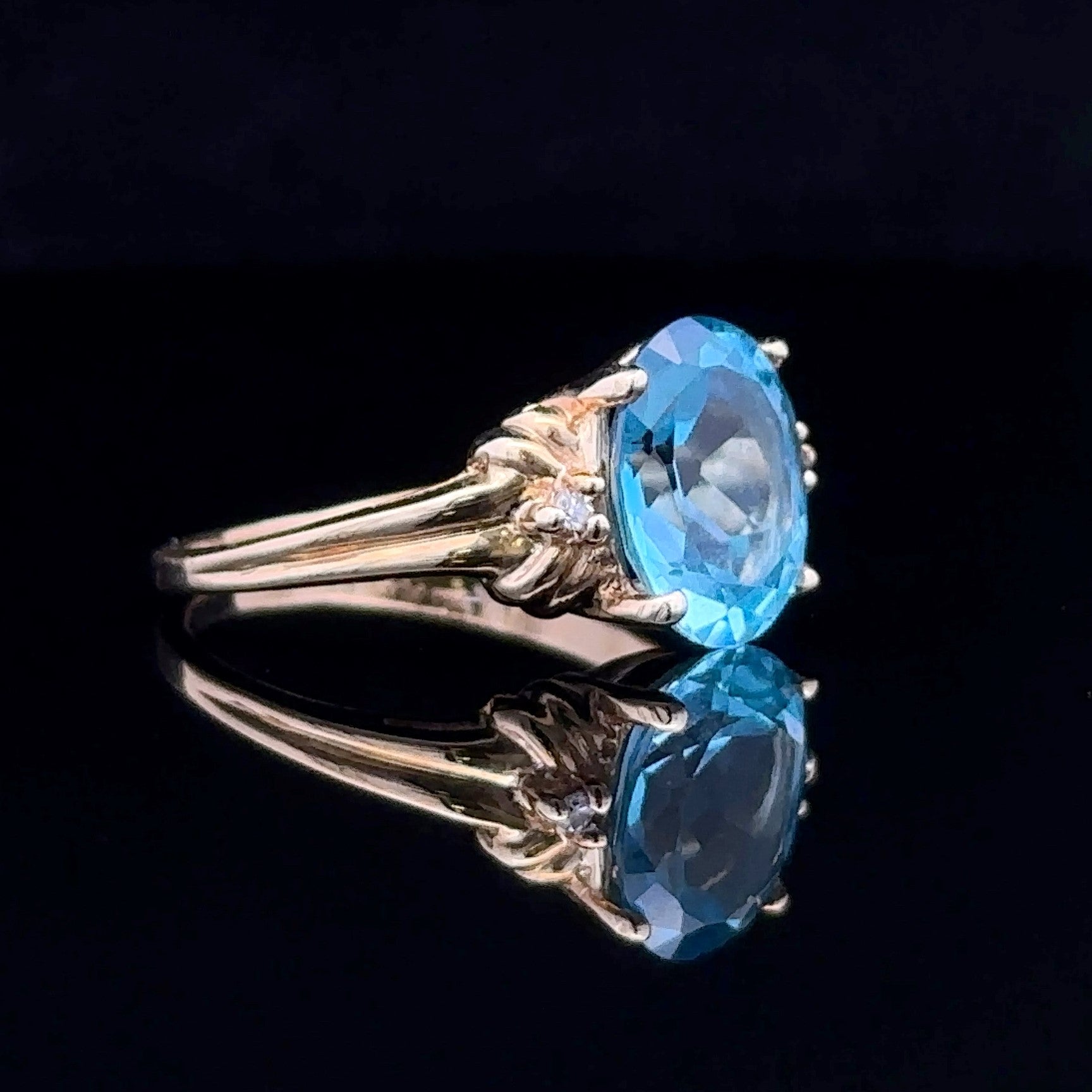 yellow gold ring with blue topaz stone
