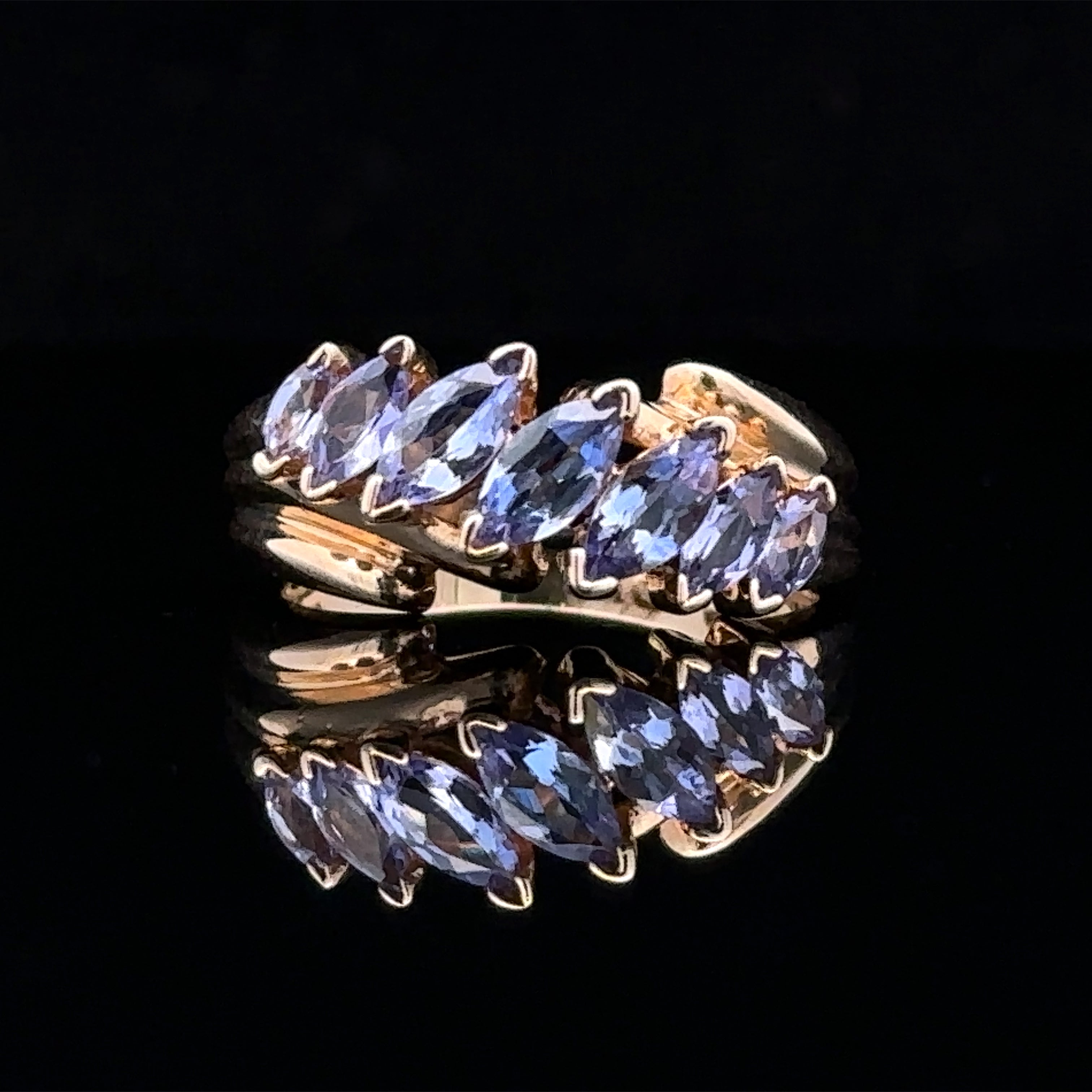 yellow 14K gold 7-stone ring with tanzanite