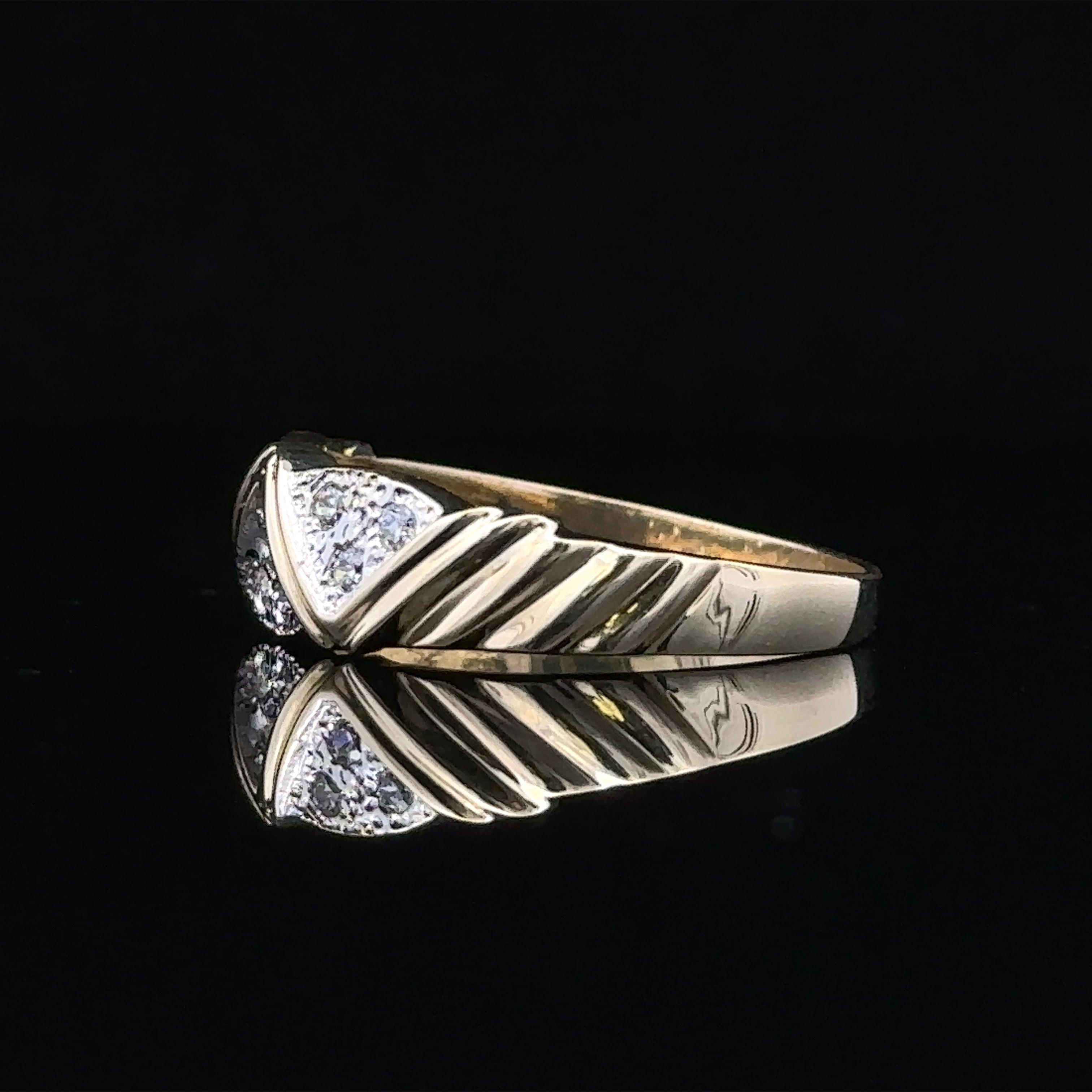 Close-up of diamonds on Morgan contemporary gold ring