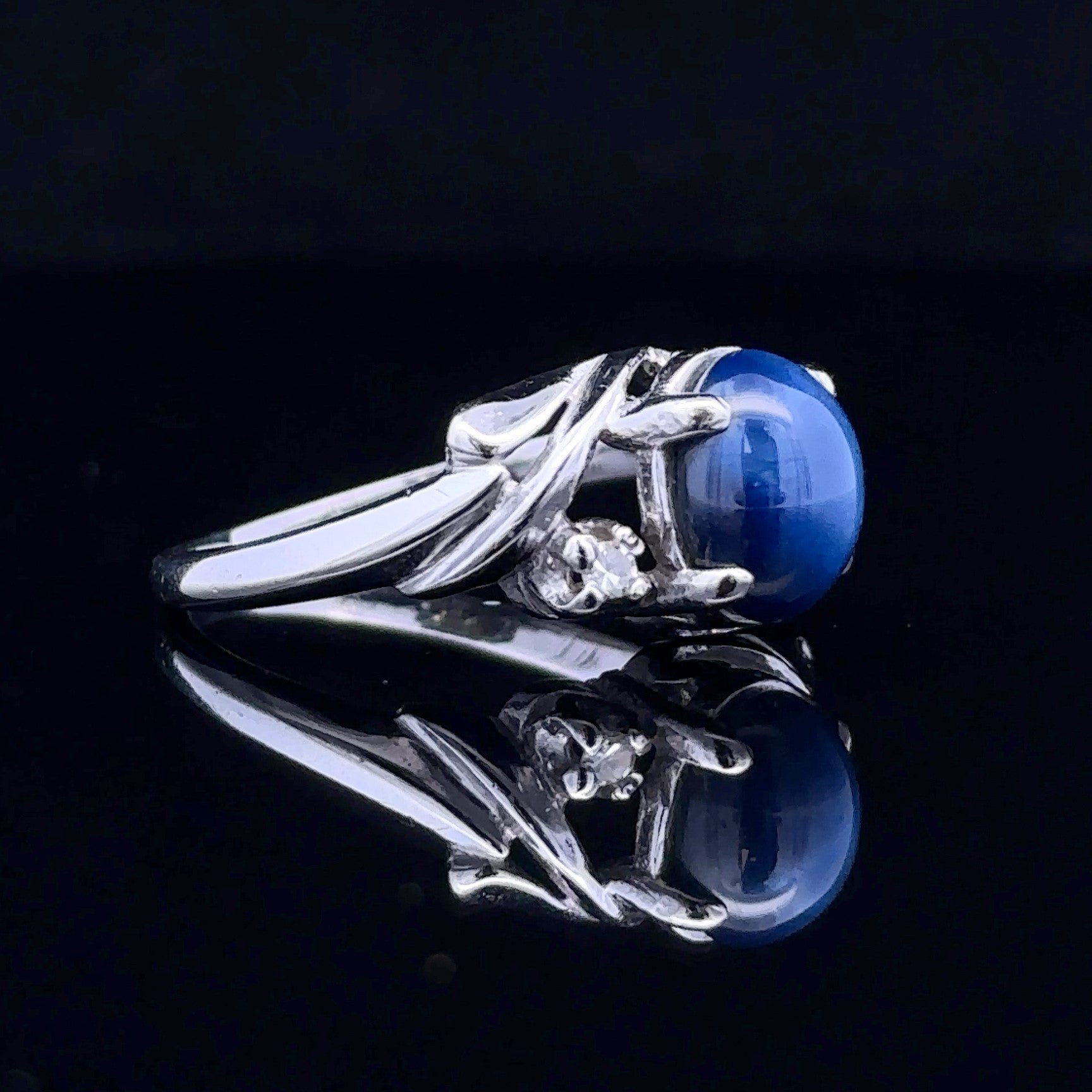 white gold ring with star sapphire and diamonds
