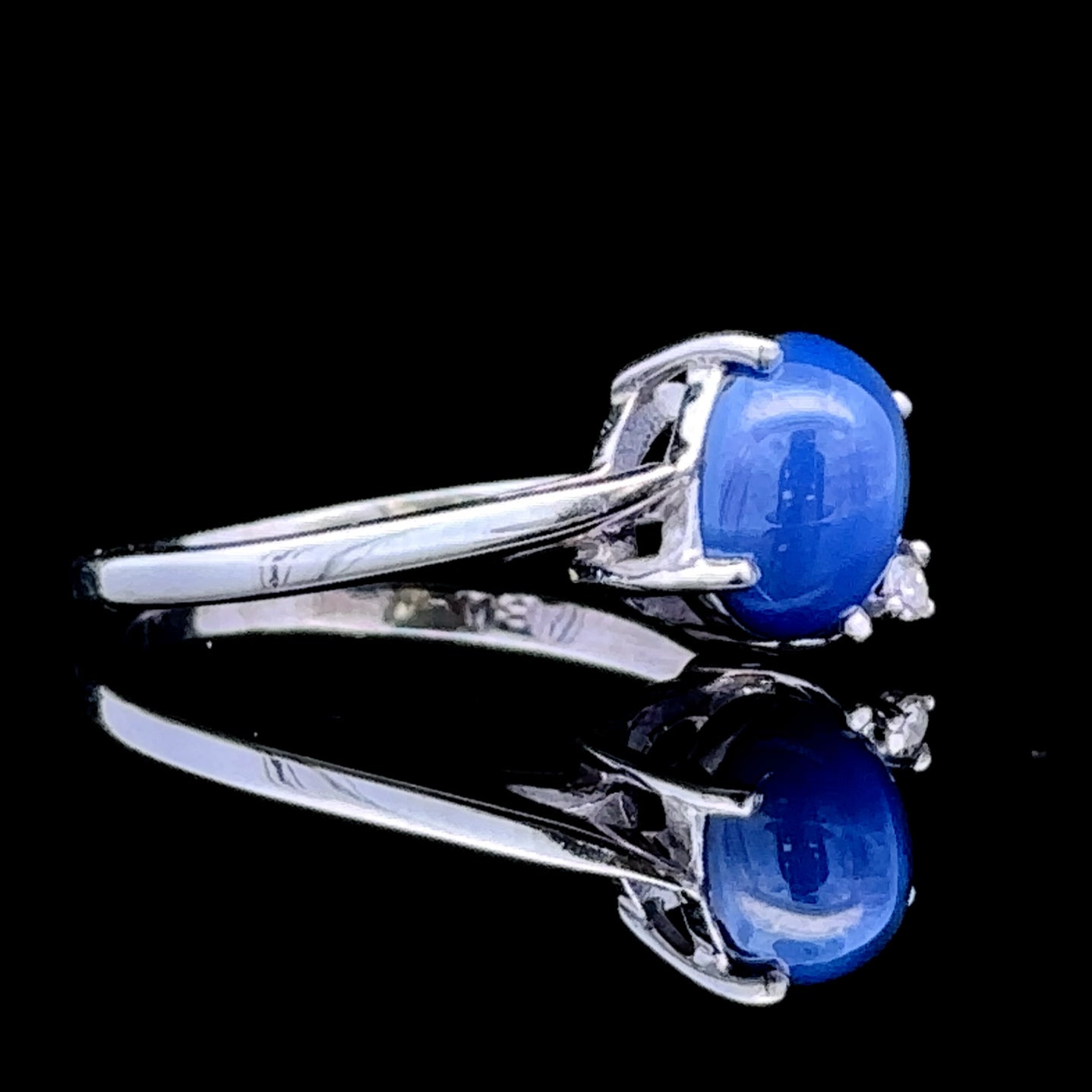 White gold ring with star sapphire and diamond accent