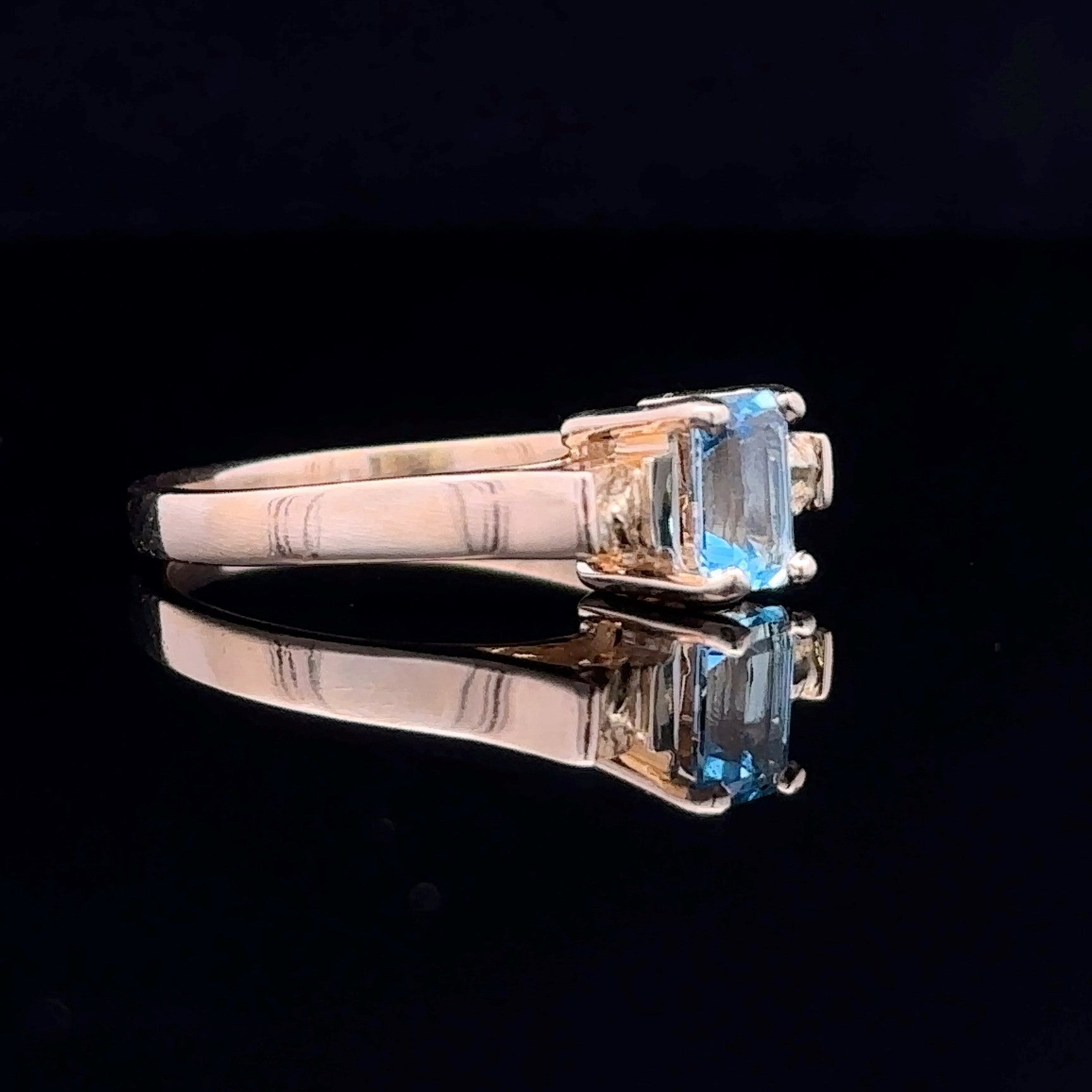 yellow gold ring with blue topaz stone
