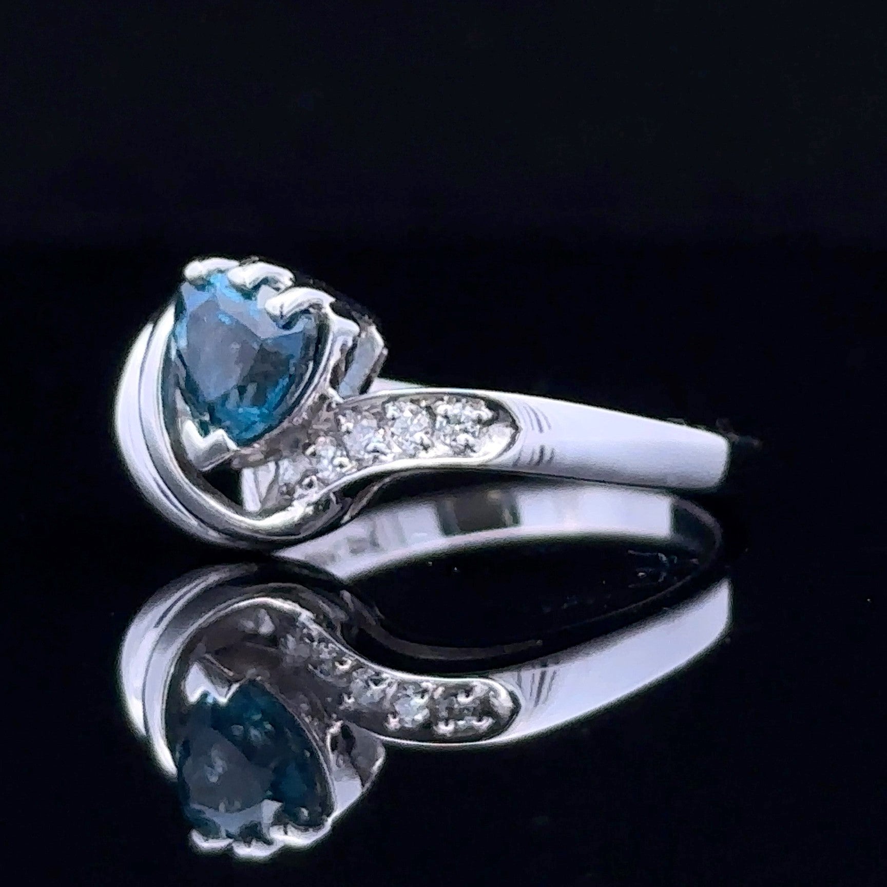 white gold ring with London blue topaz and diamonds
